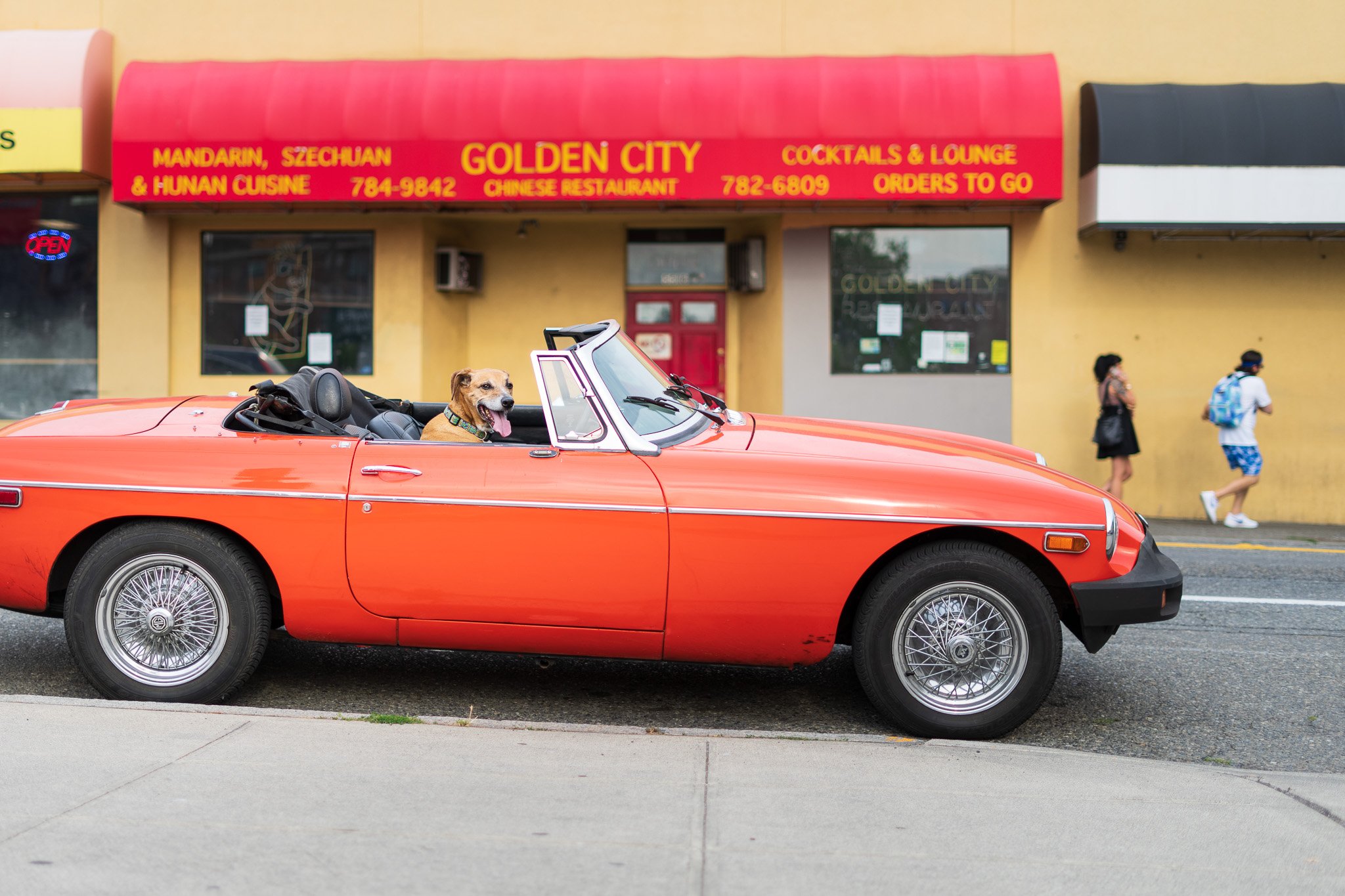 Sunlit Car on Sidewalk