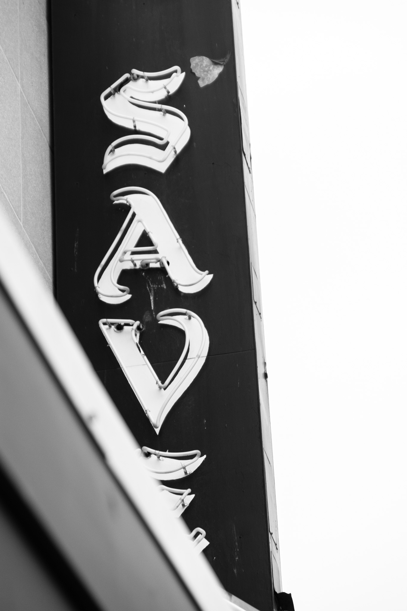 Peeling Sign on City Wall