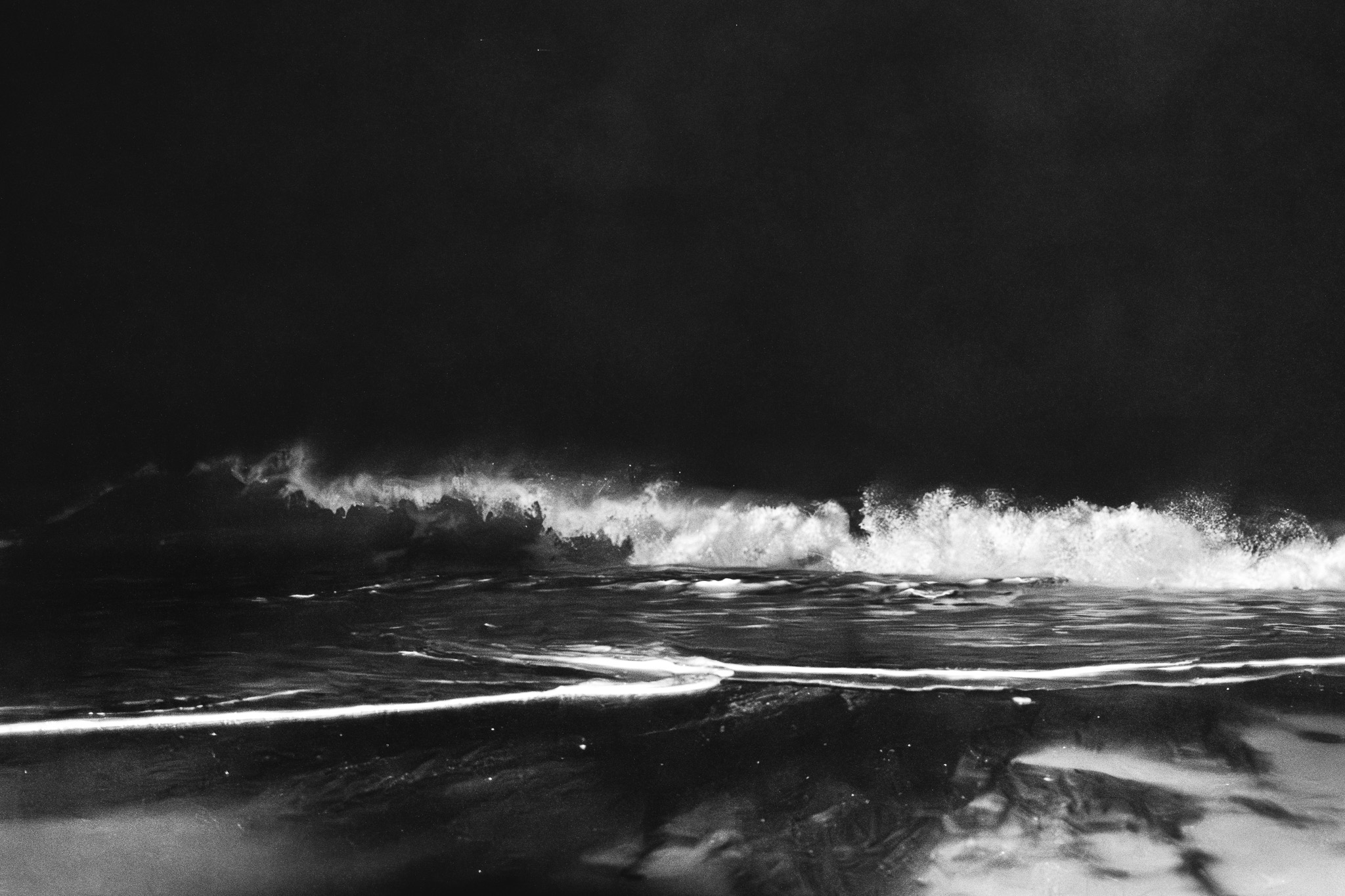 Midnight Ocean Wave Reflection