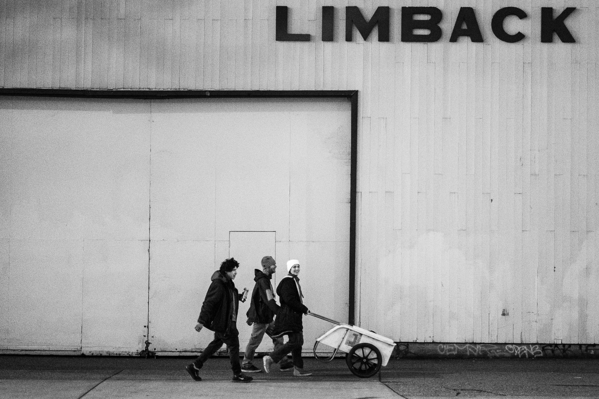Three Black Figures Walk Forward