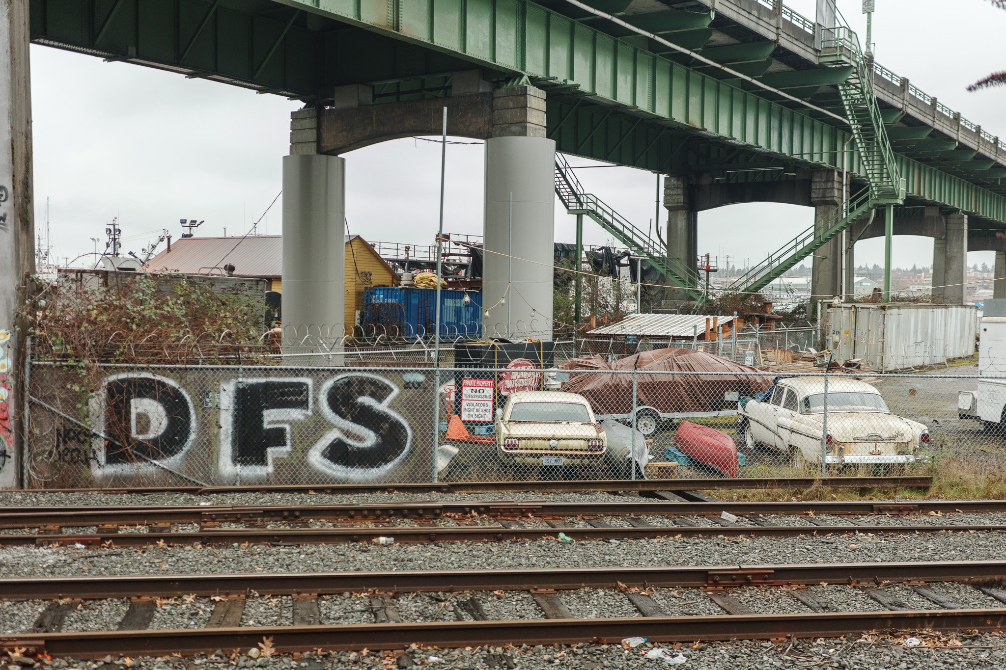 Metal Fence Over Train Tracks