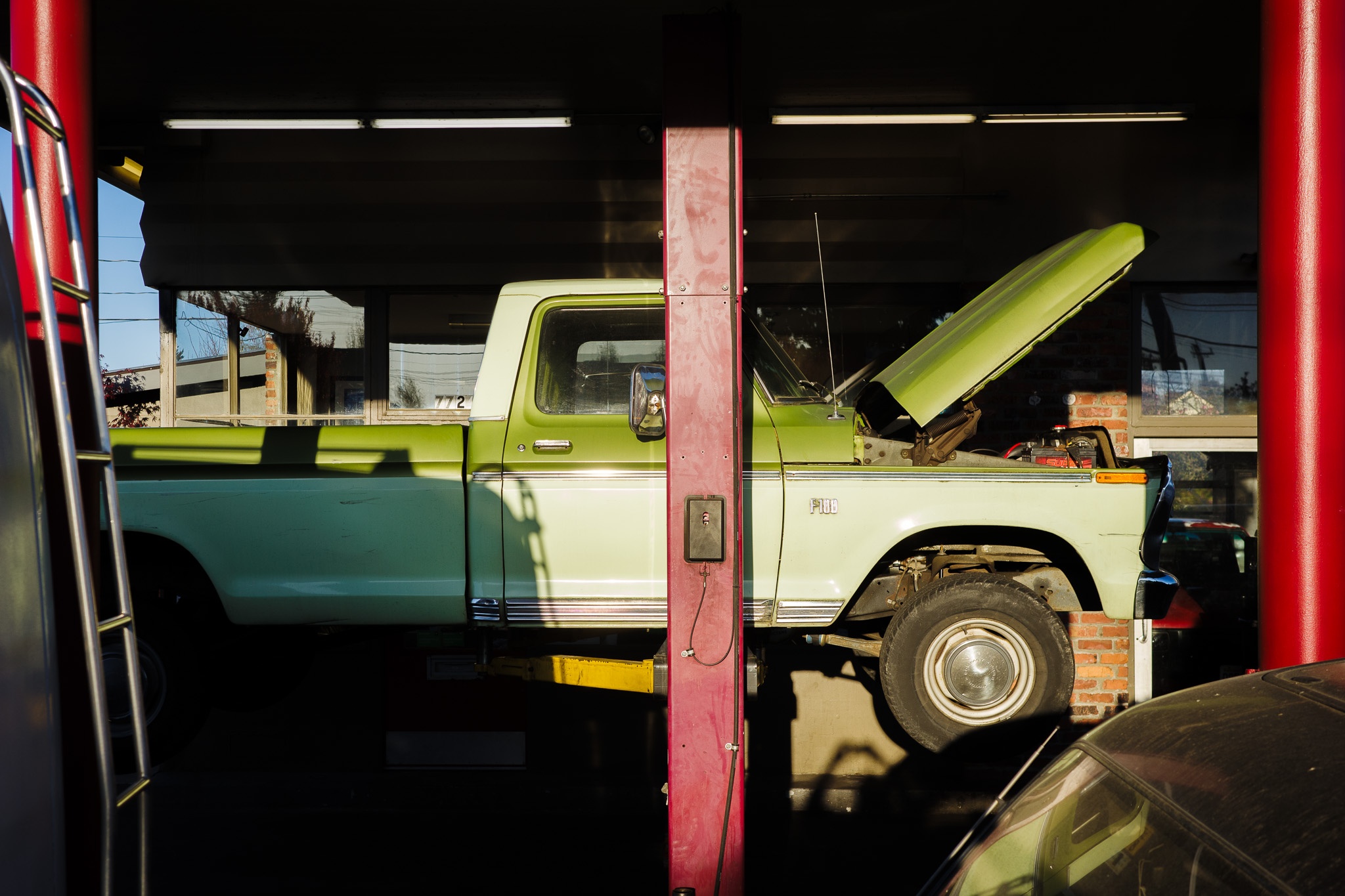 Vintage Green Pickup in Repair